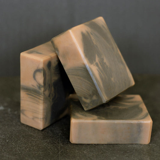 Three bars marbled with activated charcoal, scented with Bramble Berry's Hickory and Suede fragrance oil