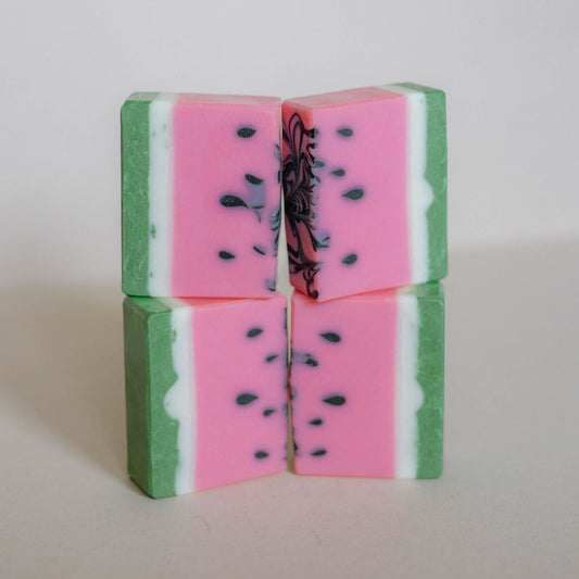 Four handmade bars of soap colored like watermelon with pink center, green and white edge. Black seeds. Scented with Bramblerry's watermelon sugar fragrance oil