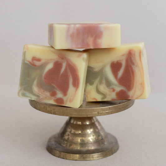 Three handmade, all-natural bars of soap swirled with French green clay, red Brazilian clay. Scented with a blend of orange and ginger essential oils.