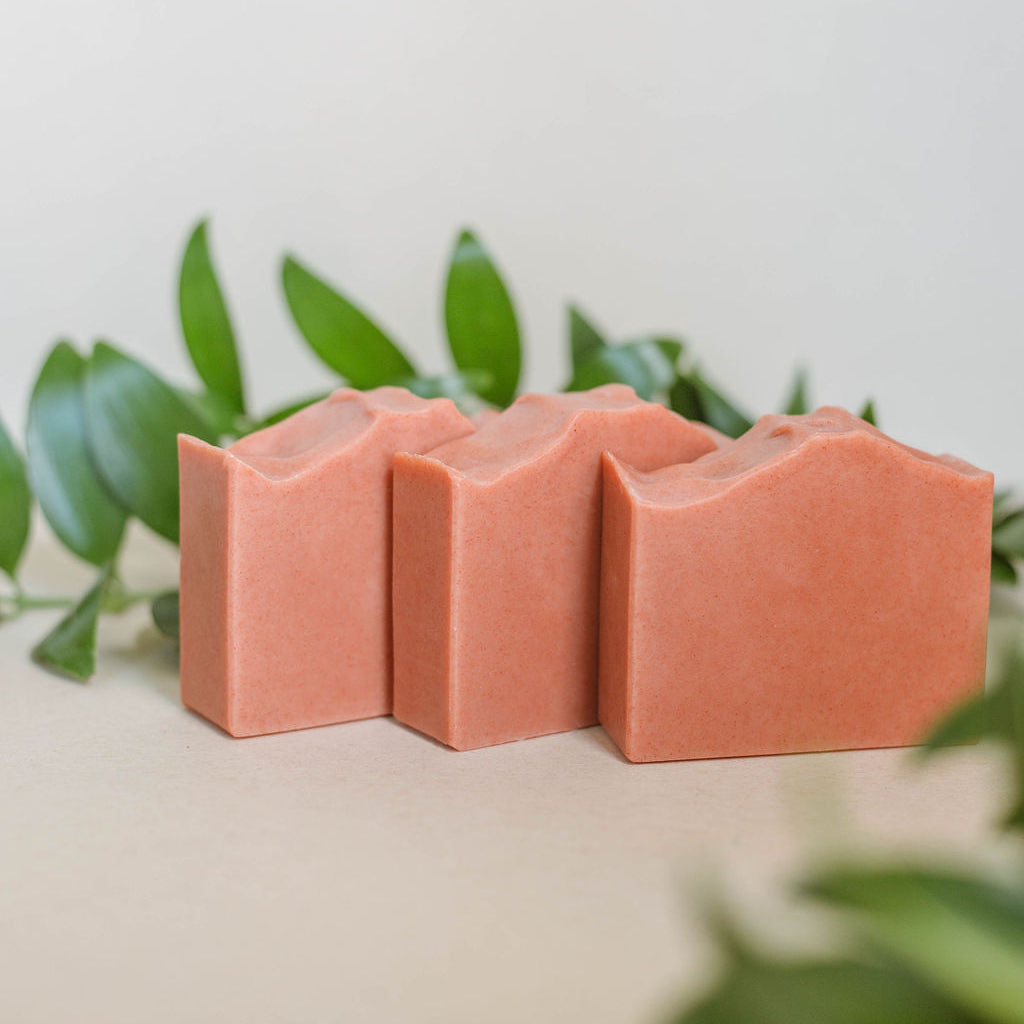 three handmade bars of pink soap scented with a blend of essential oils